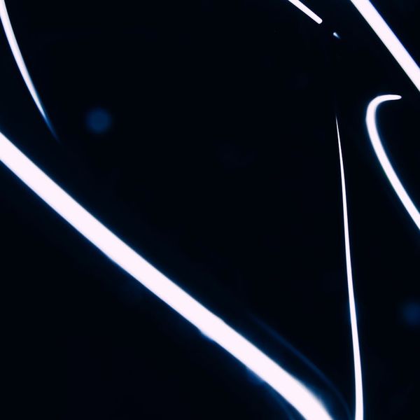 Abstract silhouette of a human body with glowing lines showing energy flow.